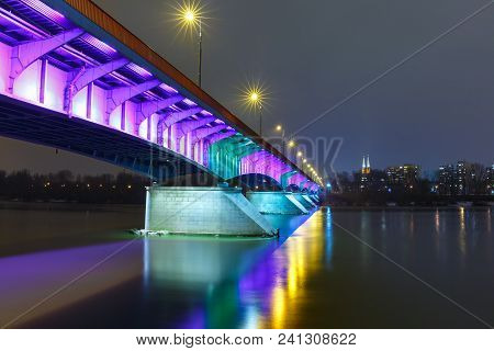 Christmas Lighting Of Slasko-dabrowski Bridge In Old Town With Reflection In The Vistula River At Ni