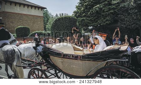 Windsor, England - May 19 2018: Prince Harry, Duke Of Sussex And Meghan, Duchess Of Sussex Leave Win