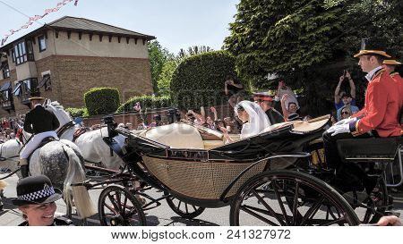 Windsor, England - May 19 2018: Prince Harry, Duke Of Sussex And Meghan, Duchess Of Sussex Leave Win