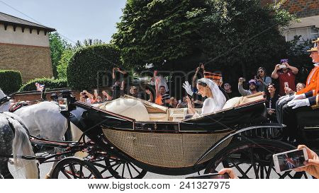 Windsor, England - May 19 2018: Prince Harry, Duke Of Sussex And Meghan, Duchess Of Sussex Leave Win