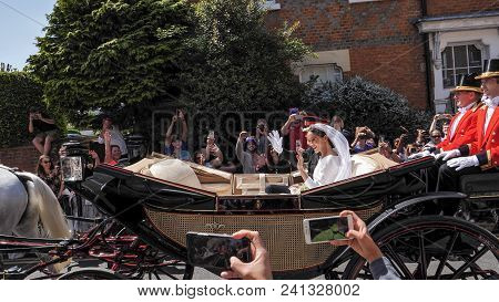 Windsor, England - May 19 2018: Prince Harry, Duke Of Sussex And Meghan, Duchess Of Sussex Leave Win