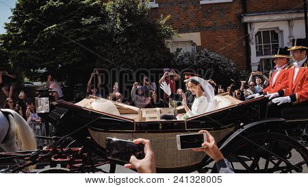 Windsor, England - May 19 2018: Prince Harry, Duke Of Sussex And Meghan, Duchess Of Sussex Leave Win