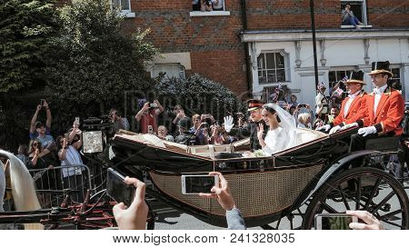 Windsor, England - May 19 2018: Prince Harry, Duke Of Sussex And Meghan, Duchess Of Sussex Leave Win