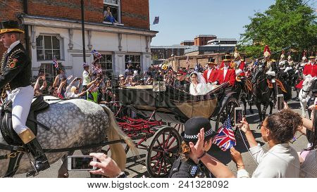 Windsor, England - May 19 2018: Prince Harry, Duke Of Sussex And Meghan, Duchess Of Sussex Leave Win