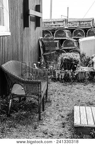 Black And White View Of A Collection Of Lobstering Gear Next To A Fishing Shack In A Village Near Ru