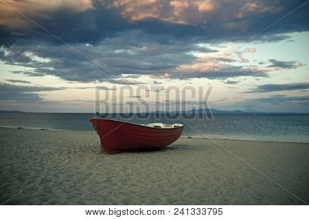 Fishermens Boat At Seacoast, On Sand At Sunset With Horisont Sea On Background. Travel And Rest Conc