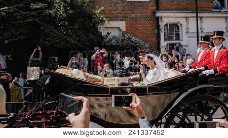 Windsor, England - May 19 2018: Prince Harry, Duke Of Sussex And Meghan, Duchess Of Sussex Leave Win