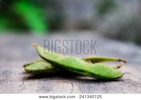 Boiled Green Soy Bean Or Edamame With Skin Lay On The Wood