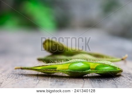 Open Boiled Green Edamame Or Soy Bean Lay On The Wood