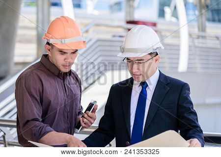 Two Asian Business And Engineer Man Has Planning And Working For Design Buiding And City.