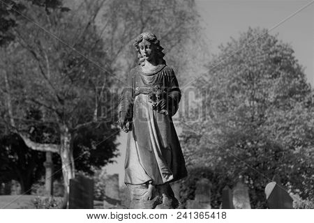 Picture Of A Statue In A Graveyard Black And White