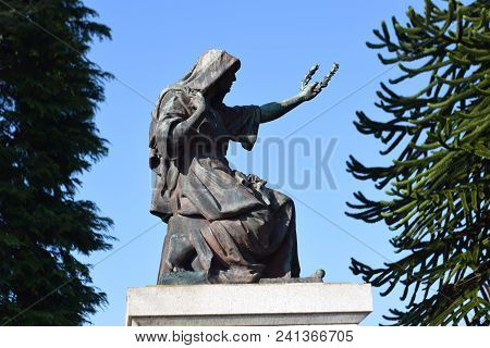 Picture Of A Statue In A Graveyard In Scotland