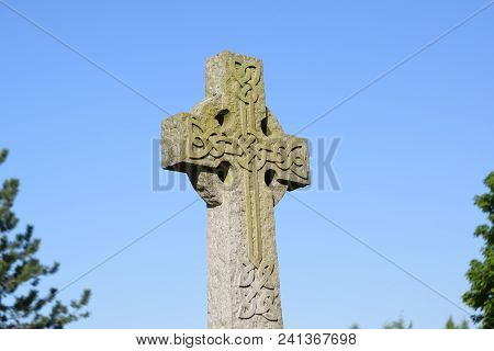 Picture Of A Scottish Celtic Cross In A Graveyard