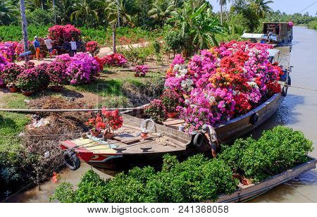 Cargo Boat Carrying Flowers In Vietnam