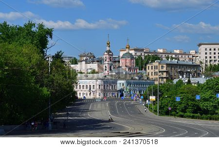 Moscow, Russia - Ustinsky Passage With A View Of The Church Of The Holy Apostles Peter And Paul.