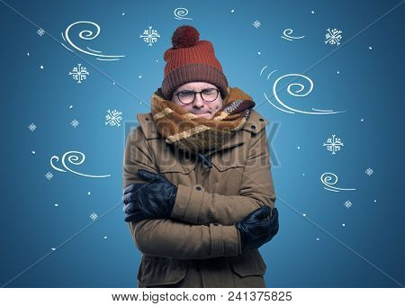 Young hipster frozen boy with doodled snowflakes and windy concept