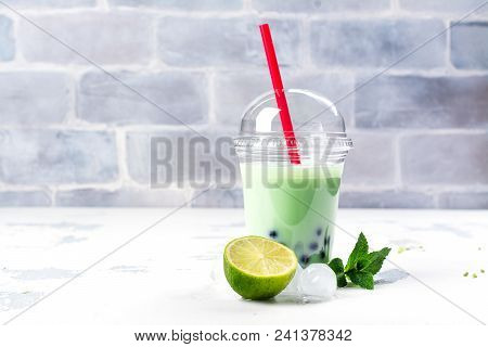 Refreshing Homemade Iced Milky Bubble Tea With Tapioca Pearls. Lime And Mint Bubble Tea In Plastic C