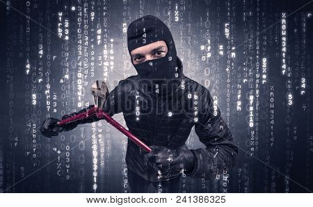 Burglar in action with encoded concept and his tools in his hand. 