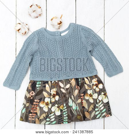Baby Dress  Botanique Palette And Cotton Flower On  Wooden Background. Flat Lay