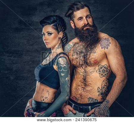 Portrait Of Shirtless, Tattooed Bearded Hipster Male And Brunette Female With Tattoo Ink On Her Tors