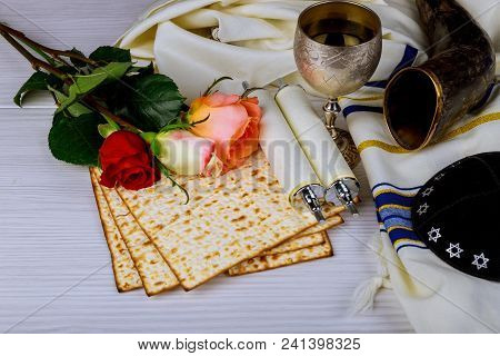 Passover Holiday Concept With Wine And Matzoh And Spring Flowers Over Background