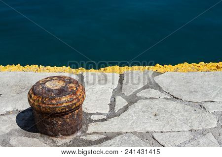 Image Of Old Harbor Cleat And Beautiful Dark Blue Sea.