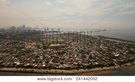 Aerial View Poor District Of Manila Slums, Ghettos, Wooden Old Houses, Shacks. Slum Area Of Manila, 