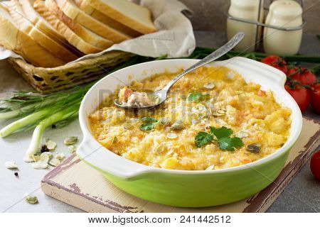 Casserole Crumble With Red Fish, White Bread And Cheese On Stone Or Slate Background. Proper Nutriti