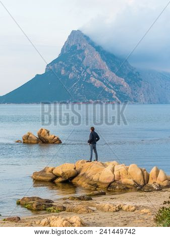 San Teodoro, Sardinia Italy - May 8 2018: Beautiful Shallow Blue Water Bay Overlooking Isola Tavara 
