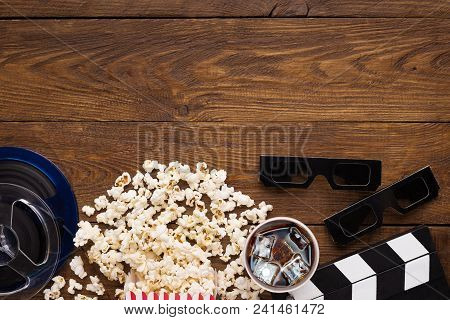 Cinema Background, Top View. Clapperboard, Popcorn, Soda And 3d Glasses On Wooden Table, Copy Space.