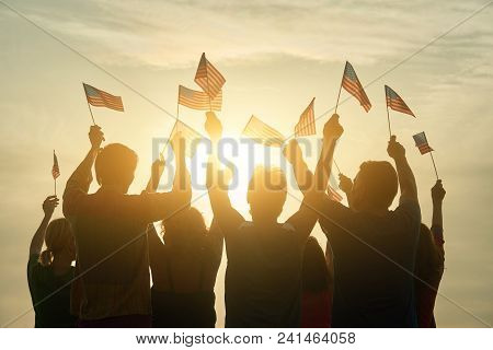 Back View People Raising Usa Flags. Patriotic American Family, Rear View.