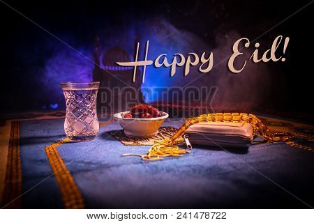 Water And Dates. Iftar Is The Evening Meal. View Of Decoration Ramadan Kareem Holiday On Carpet. Fes
