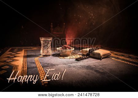 Water And Dates. Iftar Is The Evening Meal. View Of Decoration Ramadan Kareem Holiday On Carpet. Fes