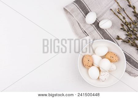Stylish Background With White And Brown Eggs In Bowl, And Goat Willow Branches On Beige Dishtowel Wi