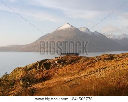 Evening At Loch Scavaig With Cuillins Mountains In Warm Sunset Light.  Isle Of Skye Scotland