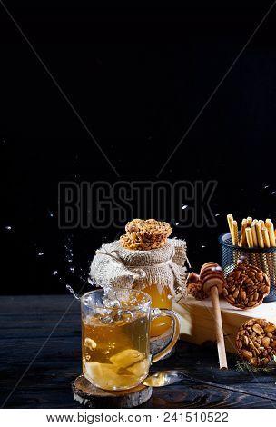 A Fragrant Flower Tea With Delicious Cookies On The Table