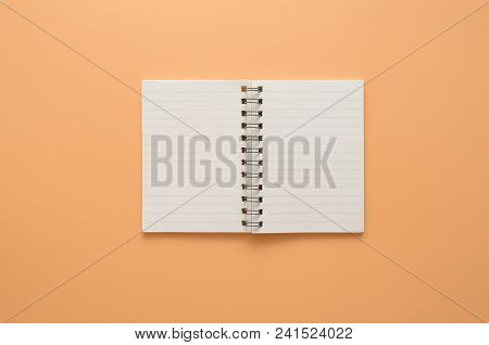 Flat Lay, Top View Blank Notebook On Brown Color Background With Coyspace.place For Text.