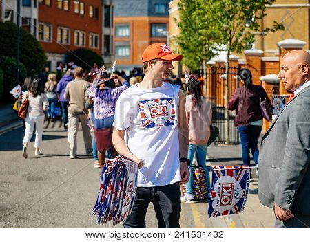 Windsor, Berkshire, United Kingdom - May 19, 2018: A Man Sell Flags As Well-wishers Move Along The S