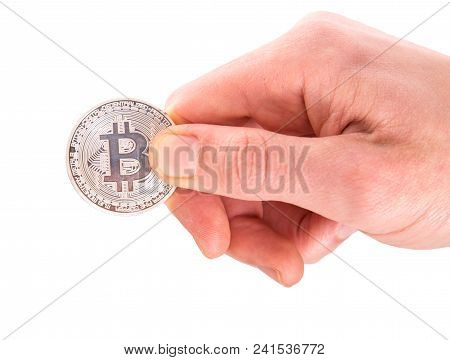 One Silver Bitcoin In A Man Hand. Digitall Symbol Of A New Virtual Currency Isolated On White Backgr