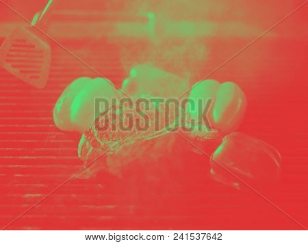 Master chef cooking delicious grilled meat steak with vegetables on a barbecue