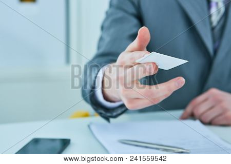 Businessman Holds Plastic Credit Card, Isolated On White. Creditor Offers Create Banking Account, Ge