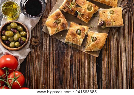 Traditional Italian Focaccia With Olives, Rosemary - Homemade Flat Bread Focaccia. Rustic Style. Top