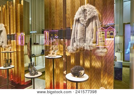 MILAN, ITALY - CIRCA NOVEMBER, 2018: shop window display of clothing and shoes at a store in Milan, Italy.