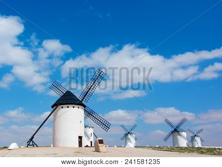 Famous Old Spanish Windmills Campo De Criptana Against Blue Cloudy Sky Outdoors. Castilla La Mancha,
