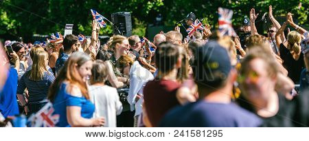 Windsor, , United Kingdom - May 19, 2018: Crowd Applauding The Royal Wedding Limousine Cortege Durin
