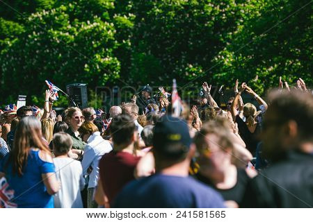 Windsor, , United Kingdom - May 19, 2018: Crowd Applauding The Royal Wedding Limousine Cortege Durin