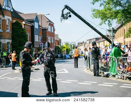 Windsor, United Kingdom - May 19, 2018: Broadcast Tv Camera, Constables Police Officers Surveilling 