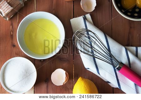 Separation The Yolk Of Egg In Little Bowl And And Preparation For The Whisking Of Egg Whites And Yol