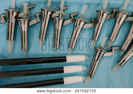 Anoscopes, Proctoscopes And Rectoscopes On Blue Medical Tablecloth