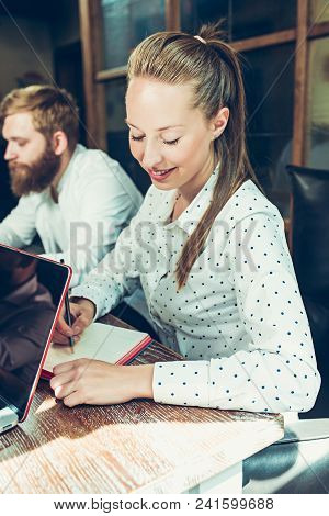 Young Cheerful People Smile And Gesture While Relaxing In Pub. Team Job. Photo Young And Mature Busi